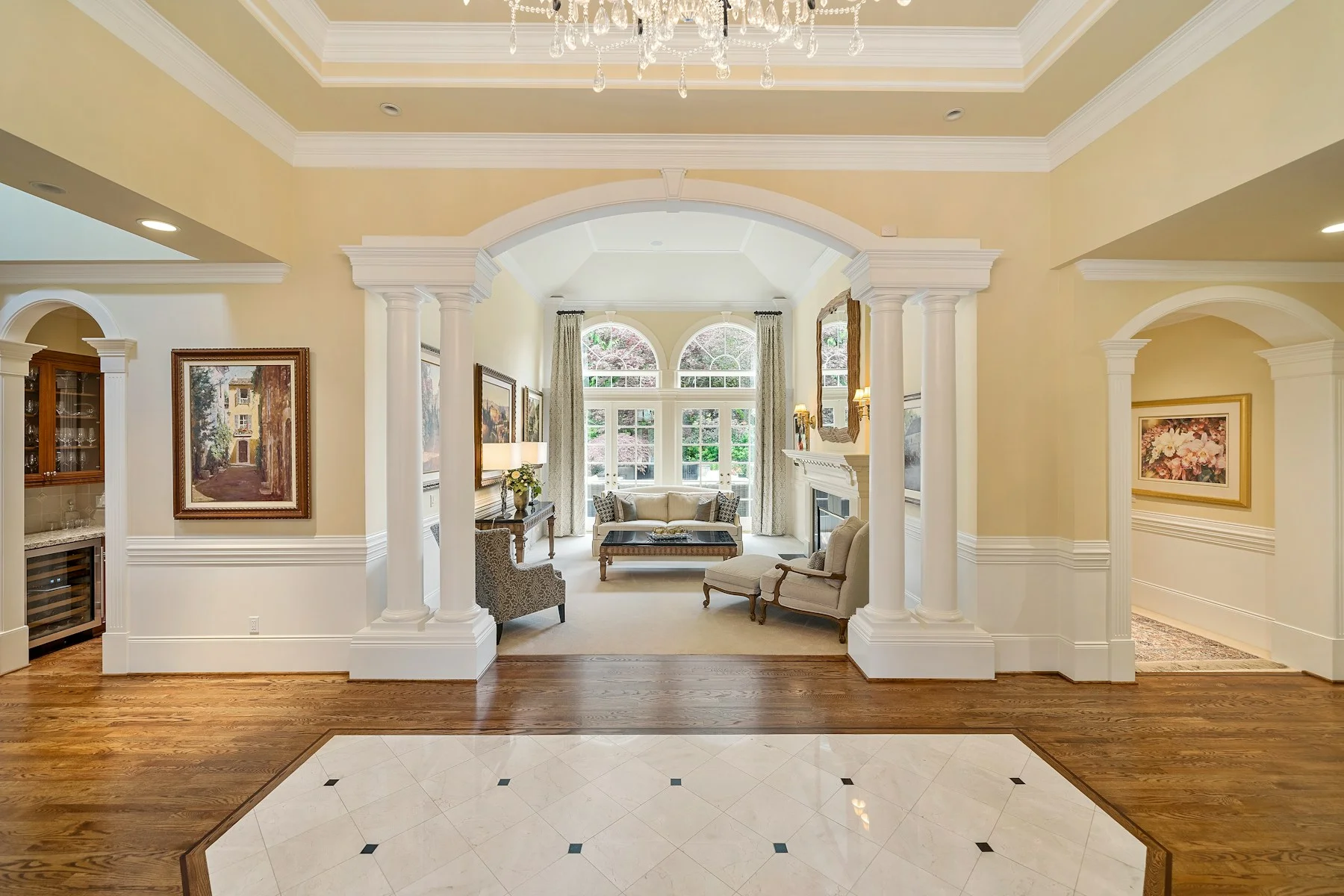 An open archway looking into a bright, welcoming living room